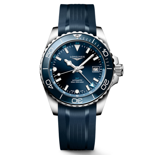 A standout in the Longines Sport Collection, the Longines HydroConquest GMT Automatic 41mm Watch features a blue rubber strap, a matching blue bezel and dial, white hour markers with Swiss Super-LumiNova for superior visibility, a date window at 3 o’clock, and the inscription “GMT AUTOMATIC 300m/1000ft” on its face.