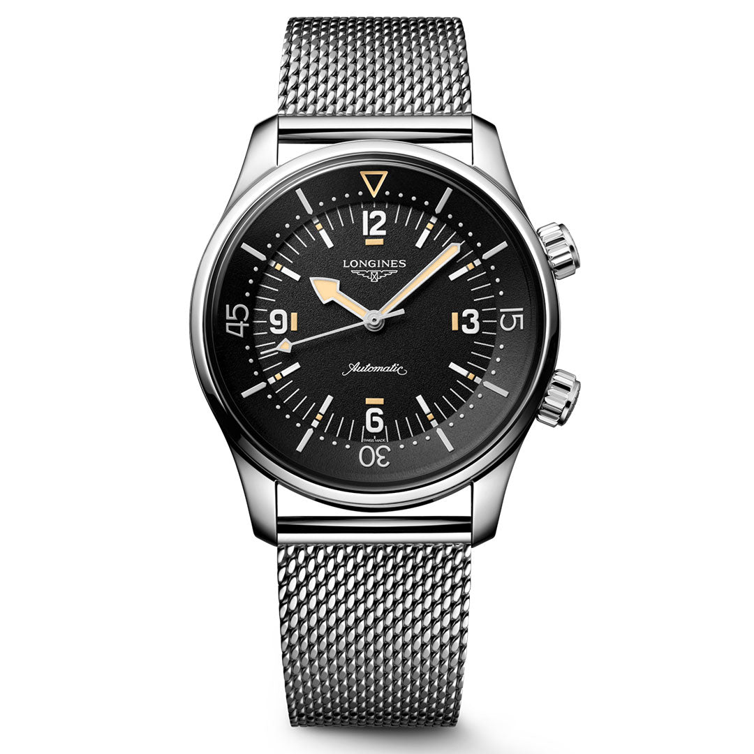 The Longines Legend Diver 59 Automatic 42mm Watch features a silver stainless steel mesh bracelet, black dial with vintage-style markers, two side crowns, and is water-resistant. Shown on a white background.