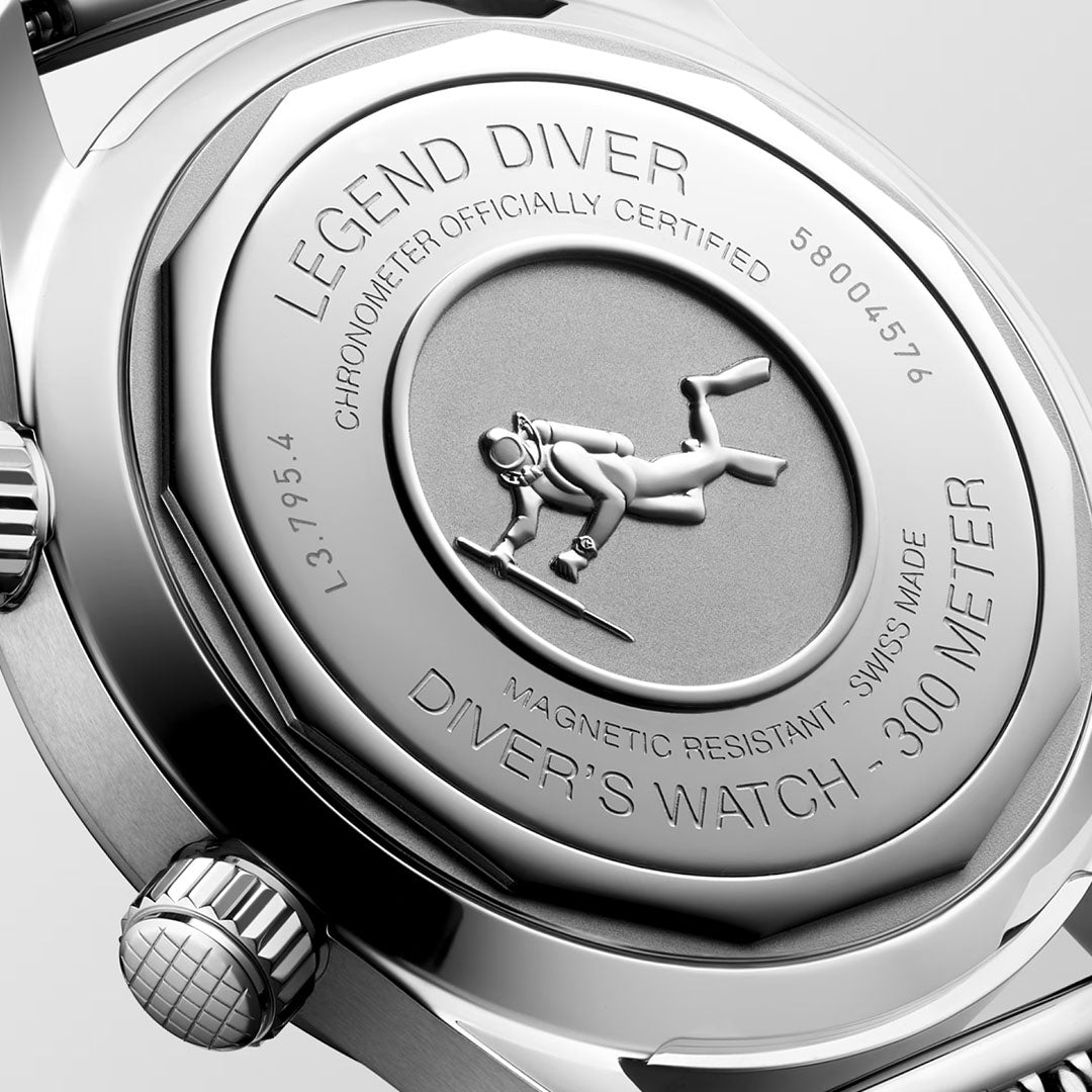 Close-up of the back of the Longines Legend Diver 59 Automatic 42mm Watch, showing a diver engraving and surrounding text: "Legend Diver," "Diver’s Watch - 300 Meter," "Magnetic resistant," with other certification details.
