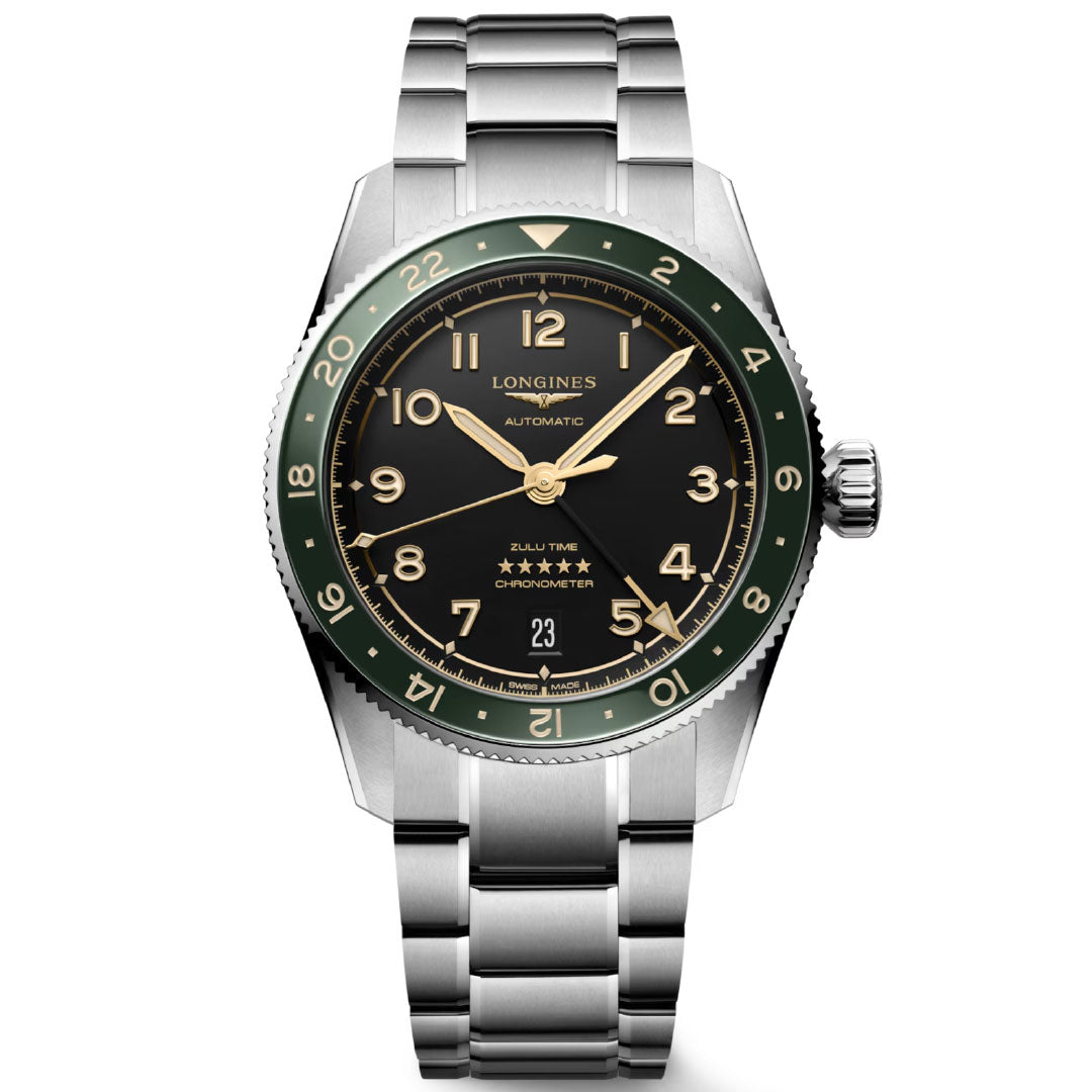The Longines Spirit Zulu Time Automatic 39mm Watch features a stainless steel case, green and black bezel, black dial with gold hour markers, metal bracelet, date display, dual time zones, and is chronometer-certified.