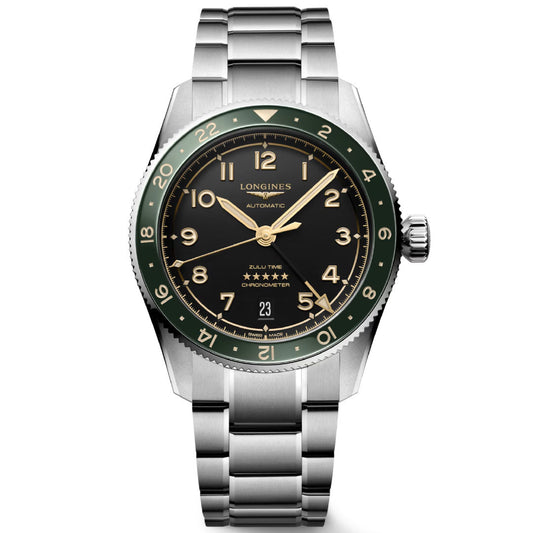 The Longines Spirit Zulu Time Automatic 39mm Watch features a stainless steel case, green and black bezel, black dial with gold hour markers, metal bracelet, date display, dual time zones, and is chronometer-certified.