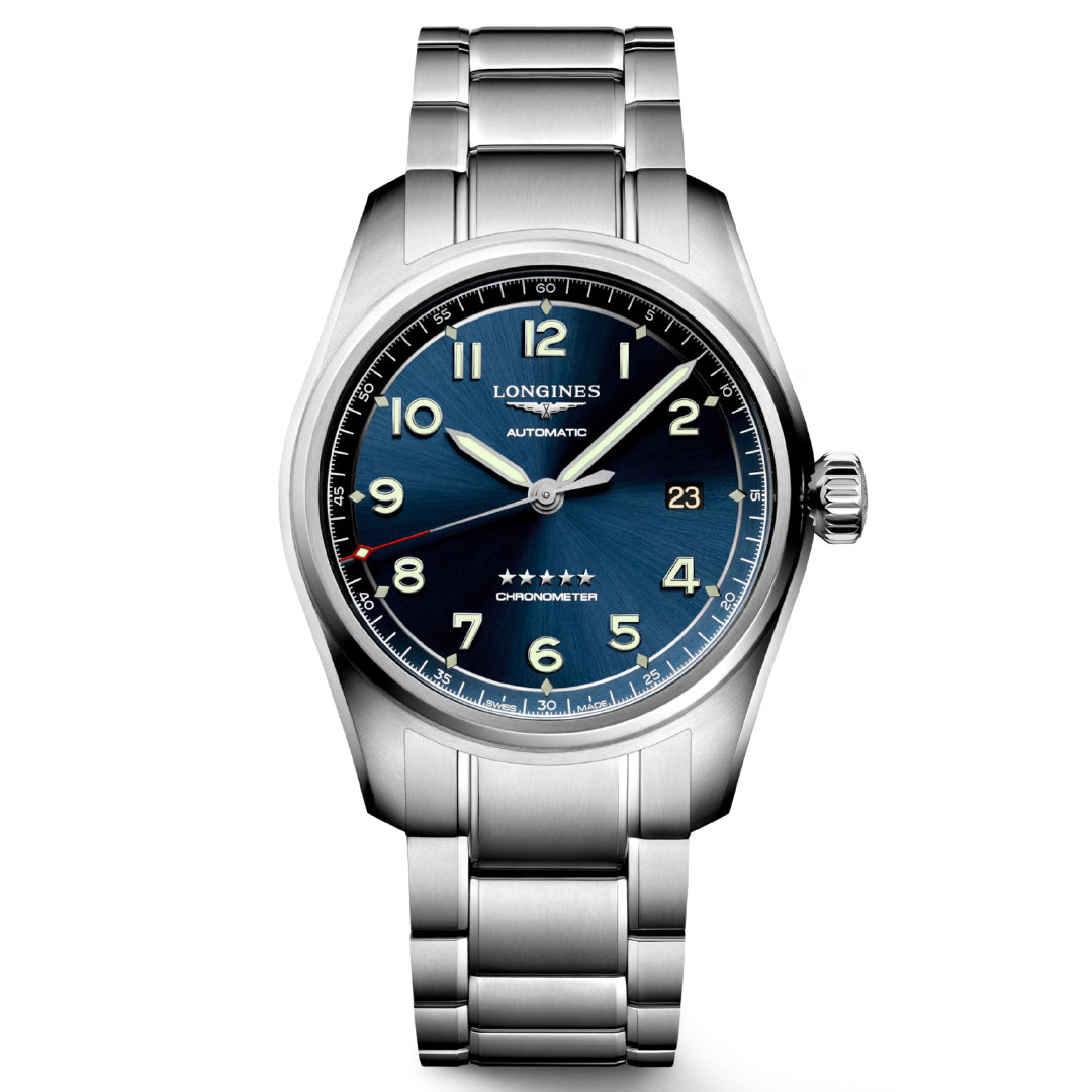 The Longines Spirit Automatic 40mm features a blue dial, silver stainless steel case, luminescent hands, Arabic numerals, a date window at 3 o'clock, and five stars above the 6 o'clock marker. The brand name Longines is displayed below the 12 o'clock position.
