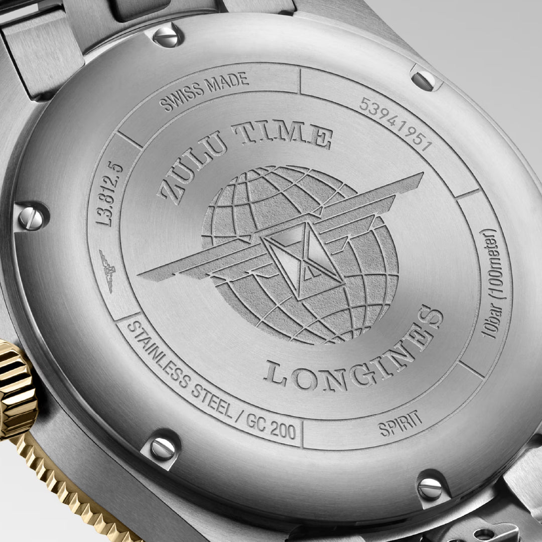 The image displays the back of a Longines Spirit Zulu Time Automatic 42mm Watch, featuring engravings of a star-like globe with text indicating "SWISS MADE" and materials such as "STAINLESS STEEL," along with serial numbers. This chronometer-certified watch also supports dual time zones.