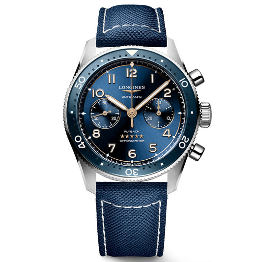 The Longines Spirit Flyback Automatic 42mm Watch is a luxury aviator's timepiece with a blue dial, leather strap, silver Arabic numerals, dual subdials, and a flyback chronograph. "Longines" is prominently displayed on the dial for added elegance.