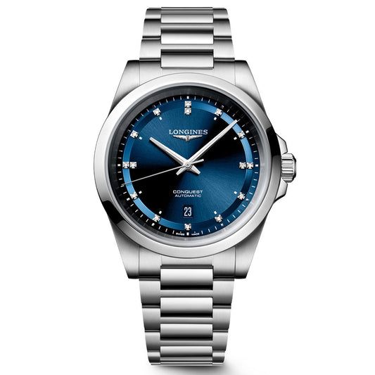 The Longines Conquest Automatic 41mm Watch features a striking blue gradient dial with silver hour markers, a date window at 6 o’clock, and a stainless steel link bracelet—an elegant Swiss timepiece by Longines that’s perfect for everyday style.