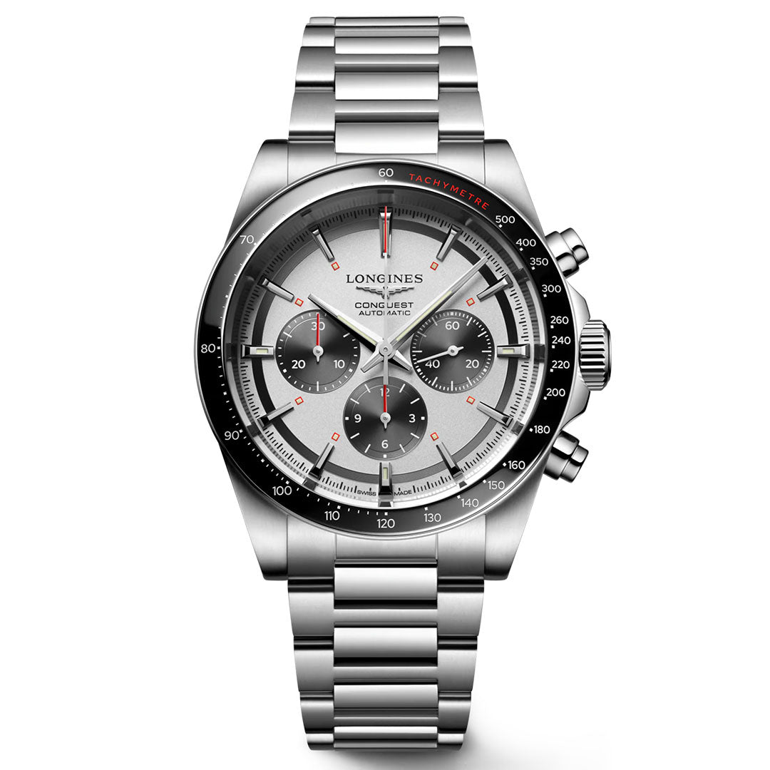 The Longines Conquest Chronograph Automatic 42mm Watch features a stainless steel case, silver dial with three subdials, black tachymeter bezel, red accents, and metal link bracelet—showcasing signature Longines craftsmanship.