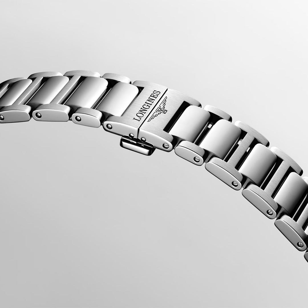 A close-up of the stainless steel bracelet of the Longines Conquest Quartz 41mm Watch features a clasp engraved with the Longines logo and winged hourglass symbol, set against a plain light background to highlight the refined craftsmanship of this renowned Swiss watchmaker.