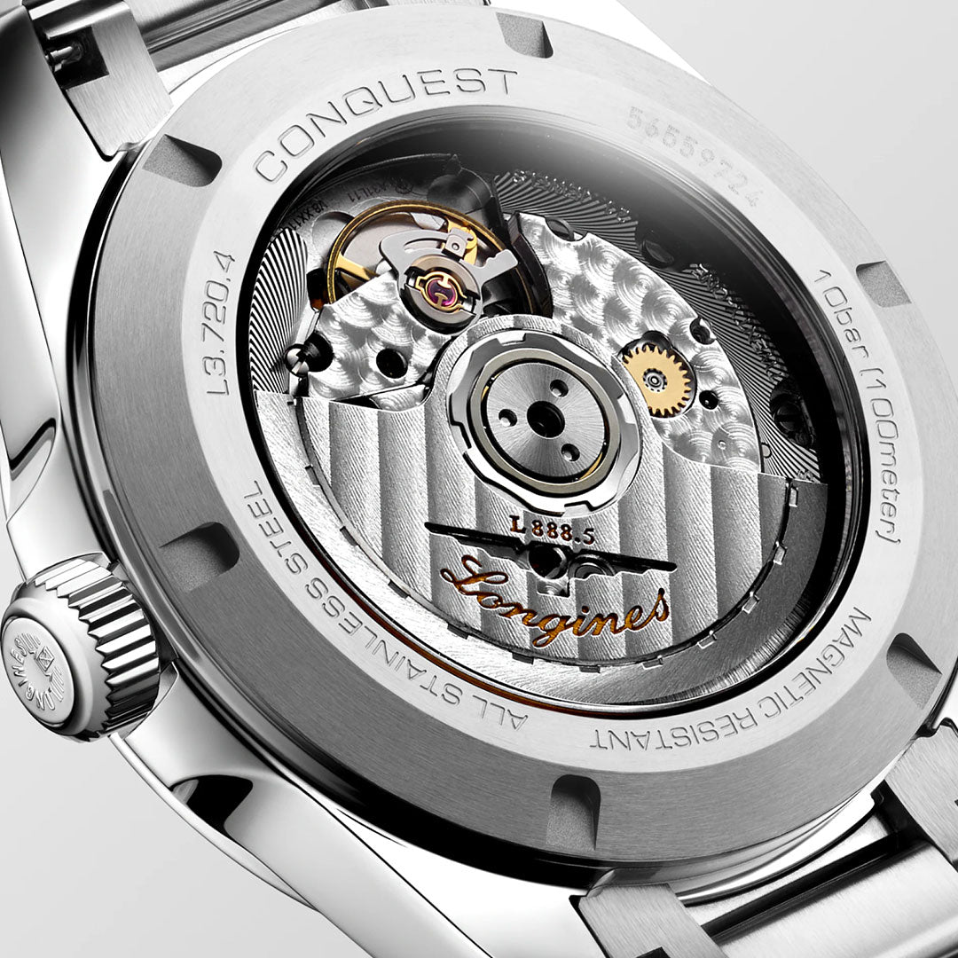 Close-up of the Longines Conquest Automatic 38mm Watch back, highlighting its sporty elegance with exposed mechanical movement, intricate gears, engraved details, and the Longines logo on the stainless steel case.