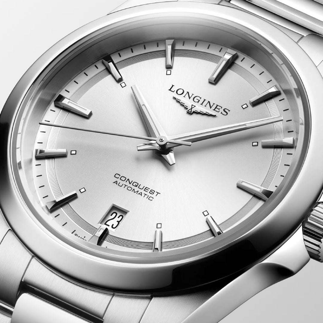 Close-up of the Longines Conquest Automatic 38mm Watch with a stainless steel band, silver dial, date at 6 o’clock, and sleek hands—highlighting the sporty elegance of this iconic Longines timepiece.