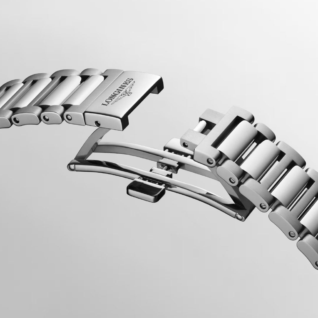 A close-up of the stainless steel bracelet and deployant clasp of the Longines Conquest Automatic 38mm Watch by Longines, partially open against a light gray background, accentuates its sporty elegance.