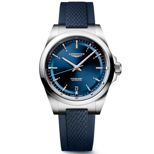 The Longines Conquest Automatic 38mm Watch features a silver case, blue gradient dial, silver hour markers, date at 6 o’clock, and a textured blue rubber strap.