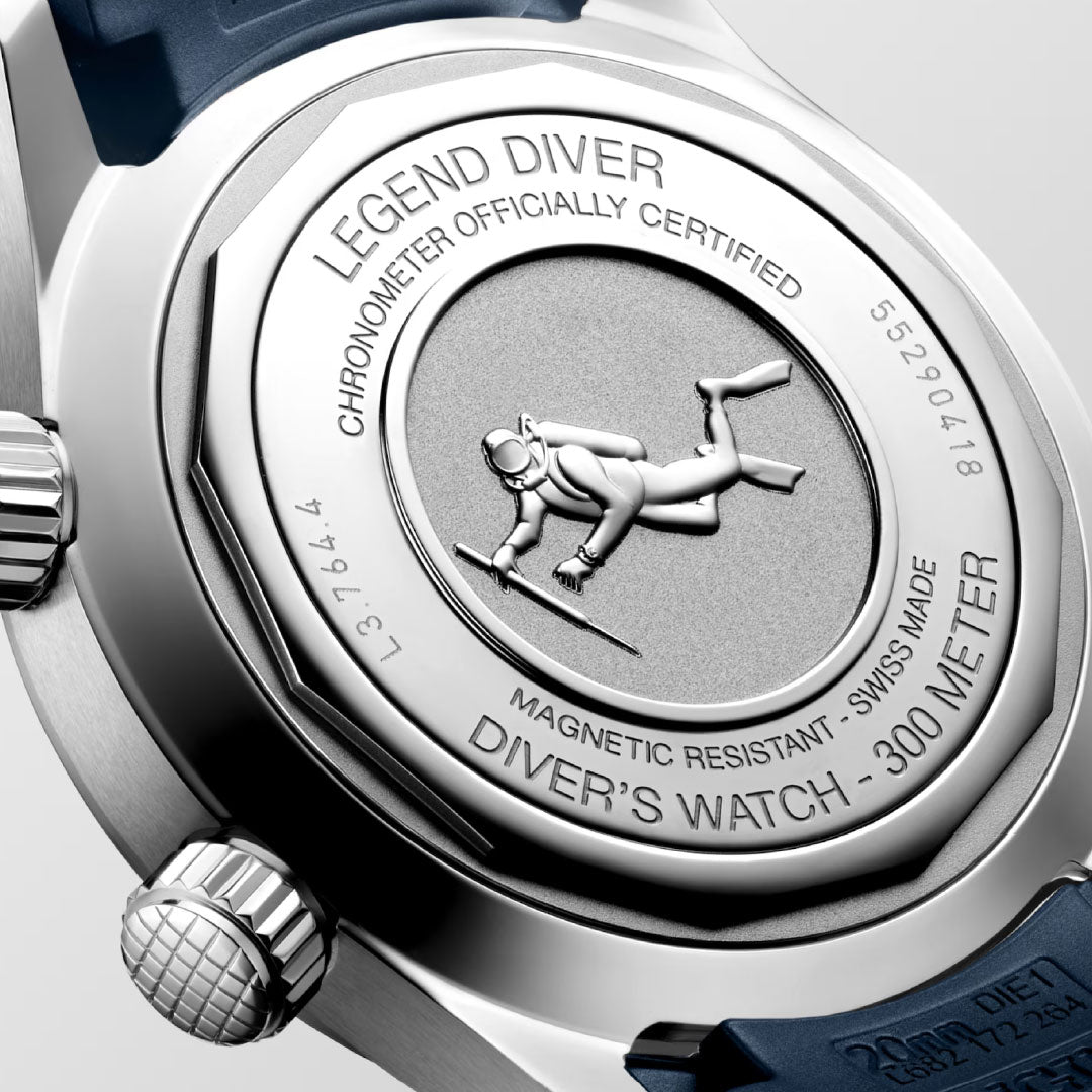 Close-up of the Longines Legend Diver Automatic 39mm Watch, featuring an engraved diver, “LEGEND DIVER” text, certification details, “DIVER’S WATCH – 300 METER,” and a dark blue strap.