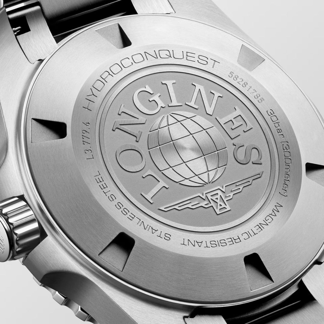 Close-up of the Longines Hydroconquest Automatic 39mm Watch, showcasing its stainless steel case back with engraved Longines logo, globe, and 300m water resistance details.
