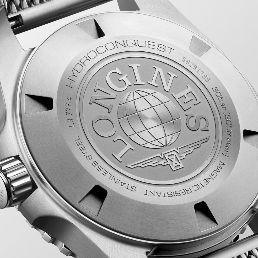 Close-up of the Longines Hydroconquest Automatic 39mm Watch back case, displaying engraved text, a globe logo, water resistance to 300m, automatic movement details, stainless steel build, and the model number.