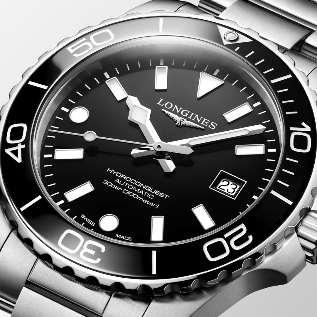 Close-up of the Longines Hydroconquest Automatic 42mm watch featuring a black dial, silver markers, rotating bezel, date at 3 o’clock, stainless steel bracelet, and water resistance up to 300m.