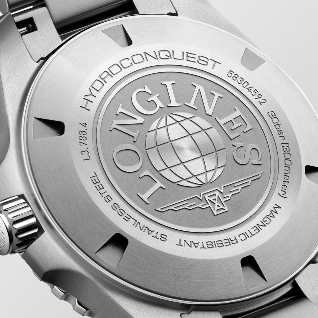 Close-up of the engraved case back on the Longines Hydroconquest Automatic 42mm Watch, showcasing the Longines logo, globe motif, and inscriptions marking its water and magnetic resistance.
