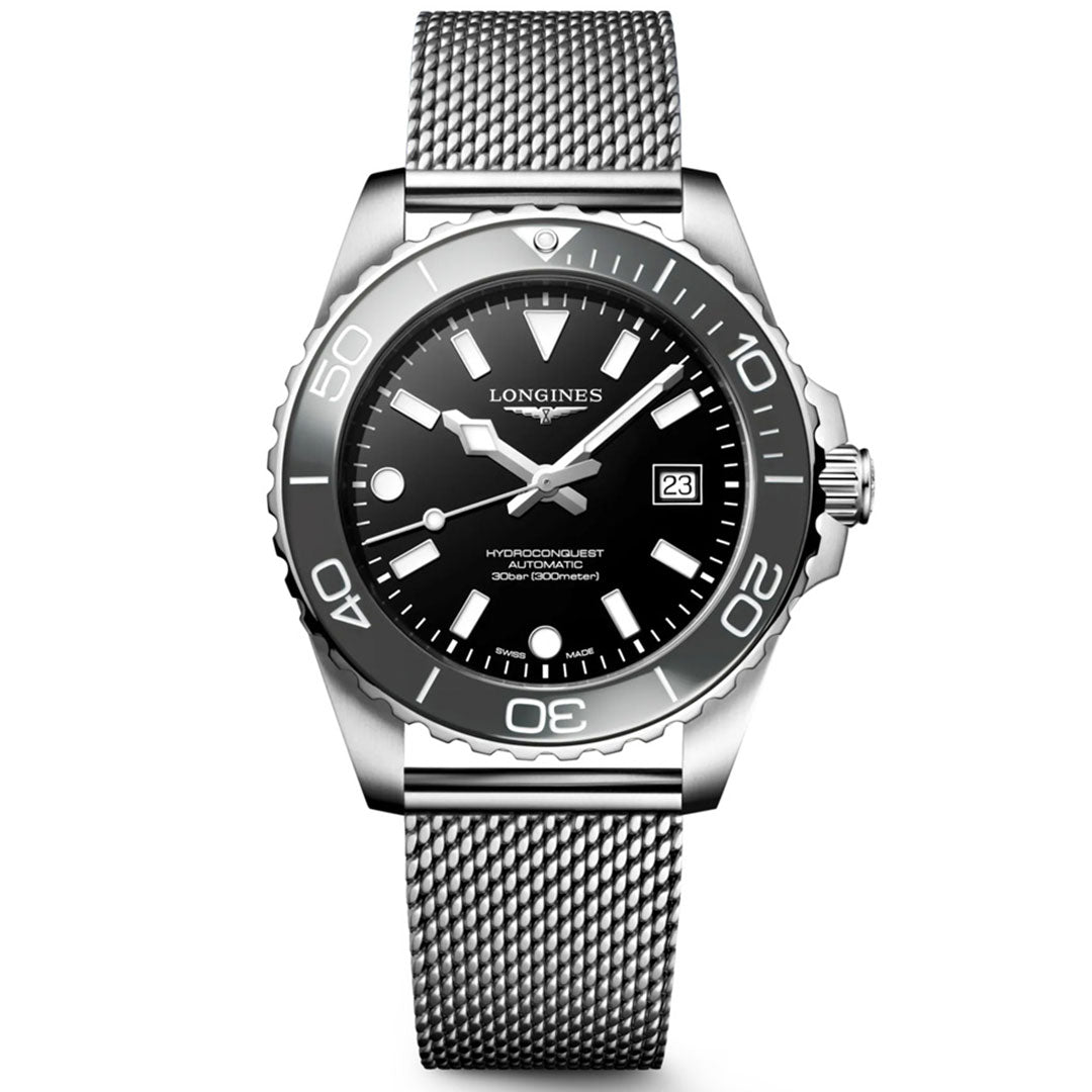 The Longines Hydroconquest Automatic 42mm Watch features a silver stainless steel mesh strap, black dial with luminous hands and markers, date at 3 o’clock, water-resistant case, and a unidirectional bezel.