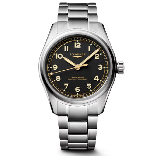 The Longines Spirit Pilot Automatic 39mm Watch features a stainless steel case, black dial, gold numerals and hands, metal link bracelet, and displays the time at 10:10.