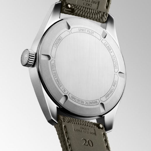 The image shows the back of a Longines Spirit Pilot Automatic 39mm Watch by Longines, featuring a green fabric strap and caseback engravings: "MAGNETIC RESISTANT, SPIRIT PILOT, L3.820.4, 5.1/70.096, ALL STAINLESS STEEL.