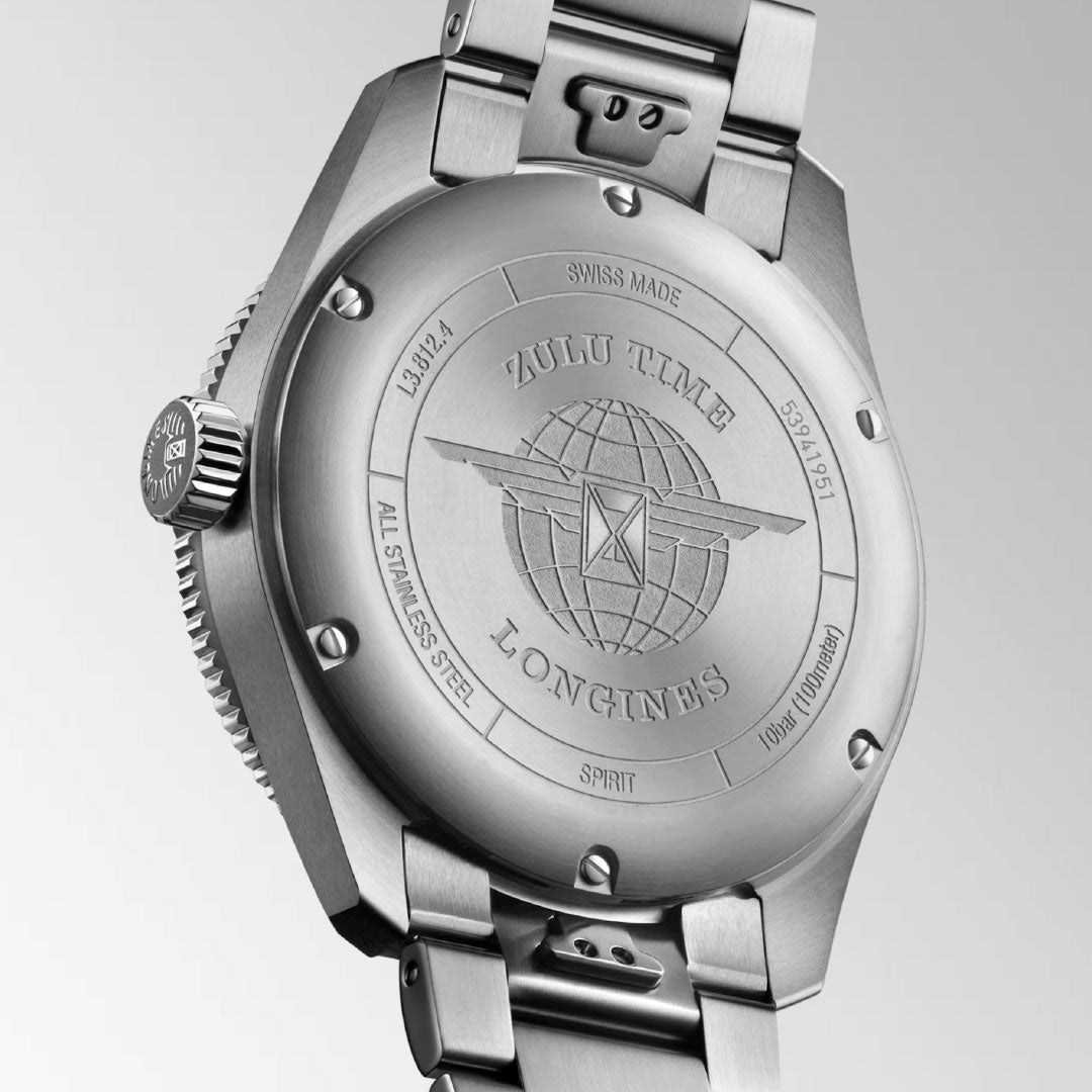 Close-up of the Longines Spirit Zulu Time Automatic 42mm Watch back, showing engraved text, a globe with wings logo, and brushed stainless steel finish.