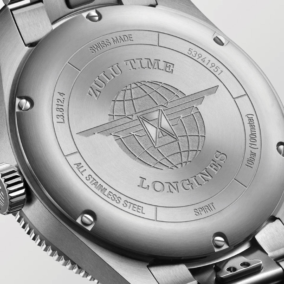 Close-up of the Longines Spirit Zulu Time Automatic 42mm shows the engraved globe-and-wings logo, “SWISS MADE,” “ALL STAINLESS STEEL,” and other specifications on the caseback of this dual time zone Longines watch.