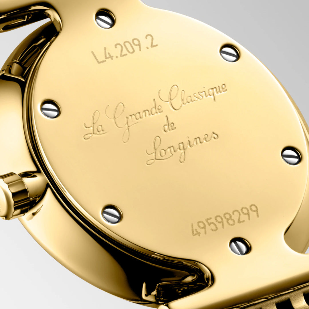 Close-up of the back of the Longines La Grande Classique Quartz 24mm Watch, engraved with "La Grande Classique de Longines," model number "L4.209.2," serial "49598299," and secured by six screws—timeless Longines elegance.