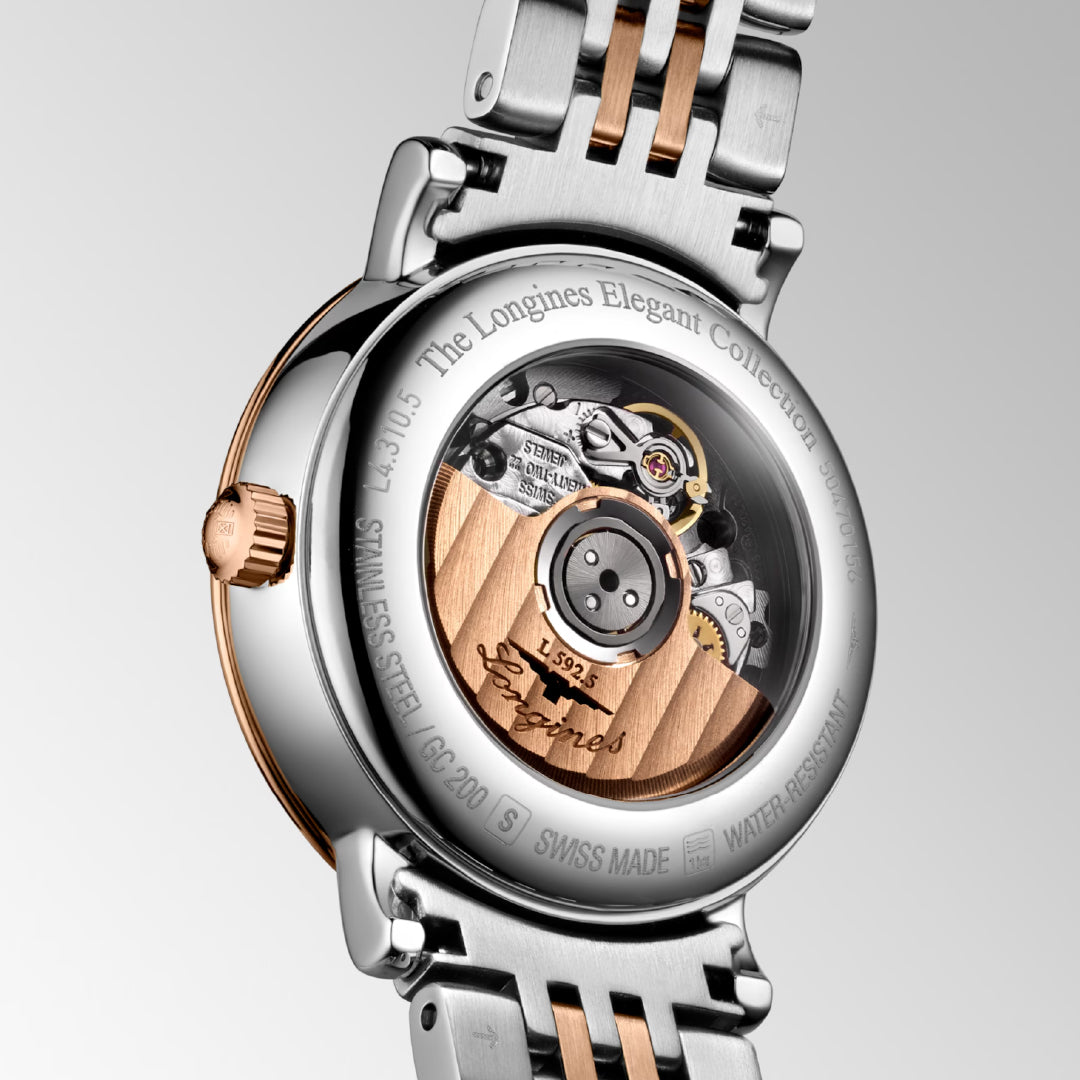 The image displays the back of the Longines Elegant Collection Automatic 29mm Watch, featuring a stainless steel and rose gold bracelet. It highlights the intricate inner mechanism with engravings "Longines," "Elegant Collection," and "Stainless Steel" against a simple gray gradient backdrop.