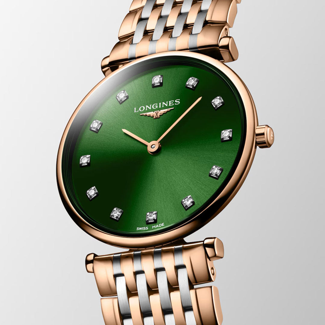 The Longines La Grande Classique Quartz 29mm Watch features a green sunburst dial, diamond hour markers, and a rose gold and silver bracelet, reflecting classic elegance by Longines.