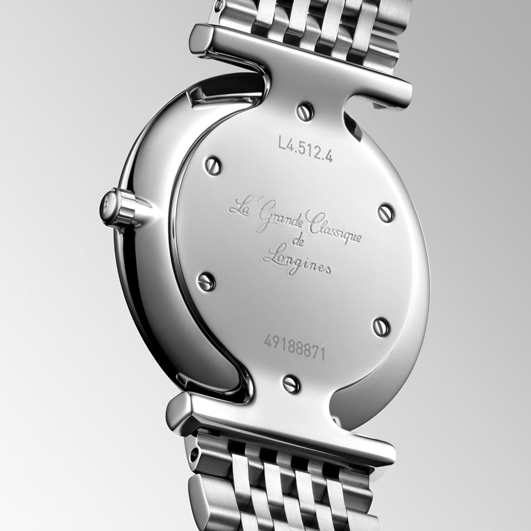 Close-up of the back of a Longines La Grande Classique Quartz 29mm Watch, showing engraved “La Grande Classique de Longines,” classic elegance, and model number “L4.512.4” with serial number “49188871.”.
