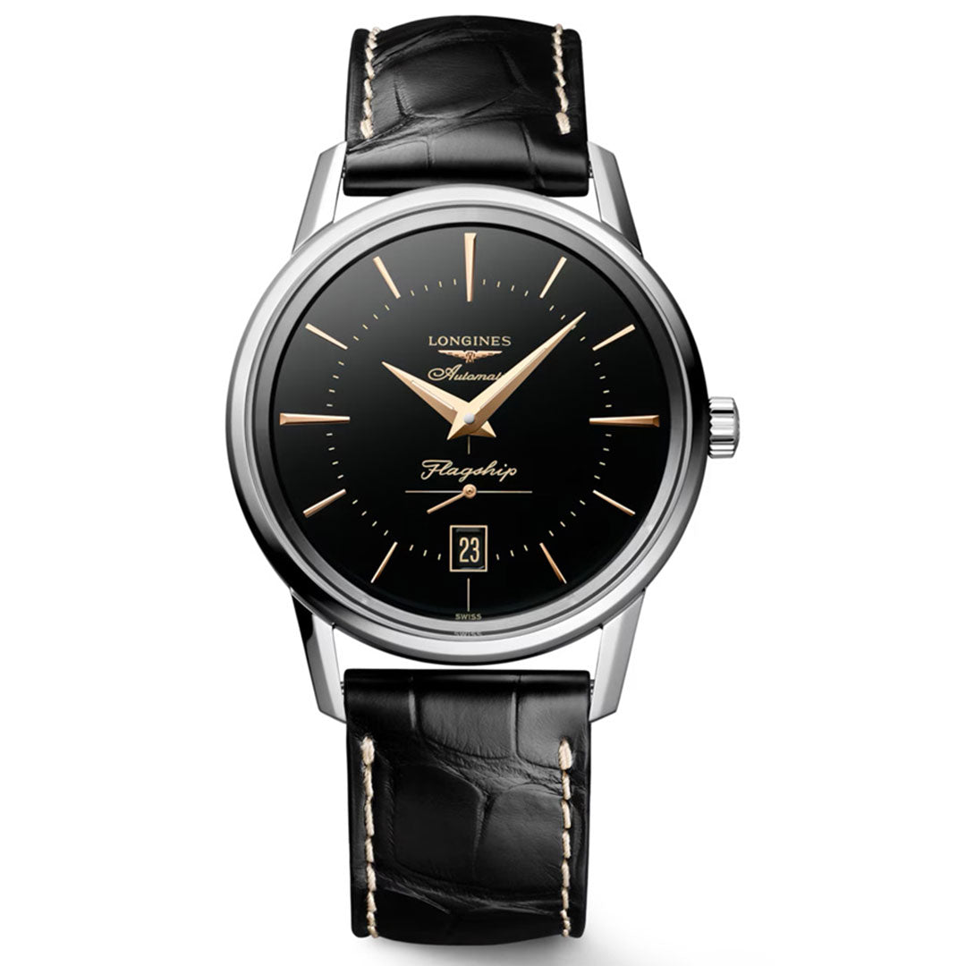 The Longines Flagship Heritage Automatic 38.5mm Watch features a black leather strap, black dial with gold hour markers and hands, date at 6 o’clock, and a silver stainless steel case—a timeless choice for classic watch lovers.