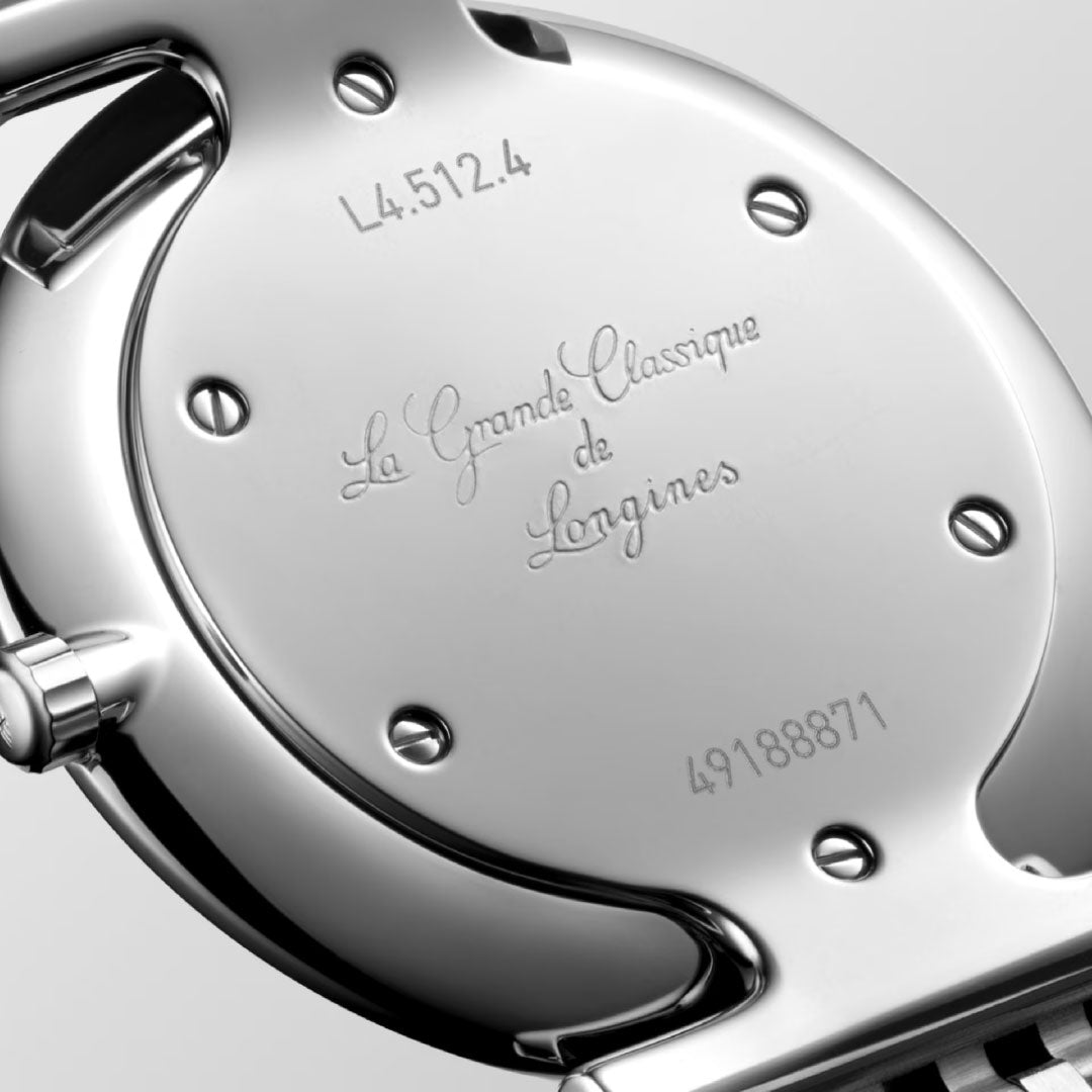 Close-up of the back of the Longines La Grande Classique Quartz 29mm Watch, engraved with "La Grande Classique de Longines," a serial number, and reference number L4.512.4.