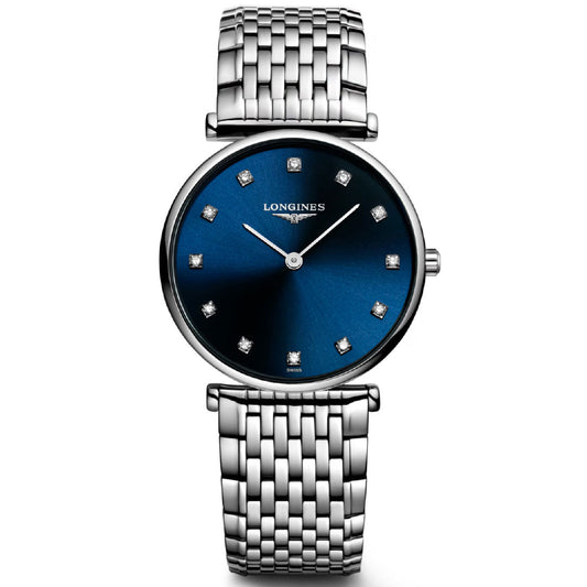 The Longines La Grande Classique Quartz 29mm Watch features a silver link band, deep blue dial with diamond hour markers, and "Longines" branding below 12 o'clock, offering classic elegance in a refined, minimalist design.