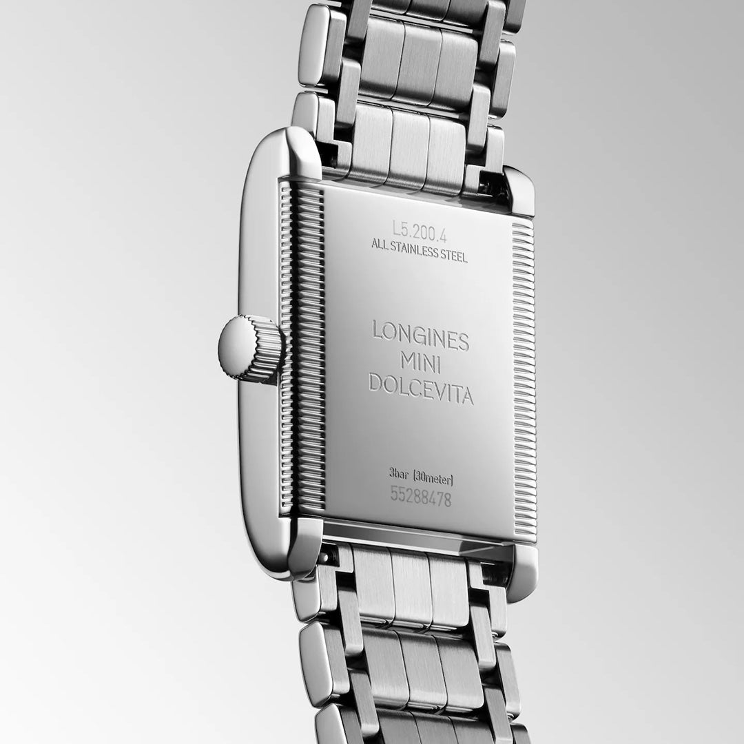 The rectangular case back of a silver-tone stainless steel Longines Mini Dolcevita Quartz 21.5 x 29mm Watch, showing engraving that includes the model name, serial number, and water resistance rating.