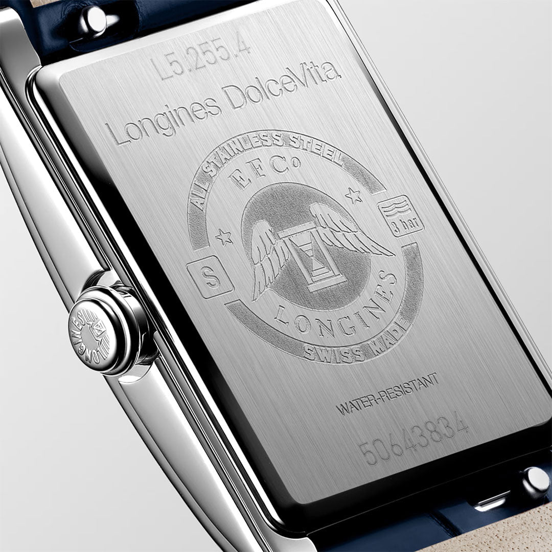 Close-up of the back of a Longines Dolcevita Quartz 20.8 x 32mm Watch, highlighting the brand’s timeless elegance with finely engraved text, the signature Longines wings-and-hourglass logo, and crisp details about its stainless steel construction, water resistance, and unique serial number—quintessential hallmarks of luxury timepieces.