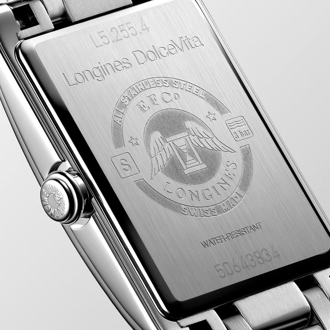 Close-up of the Longines Dolcevita Quartz 20.8 x 32mm Watch back, showcasing engraved logos and serials on the polished stainless steel—a refined touch of Longines luxury and elegance.