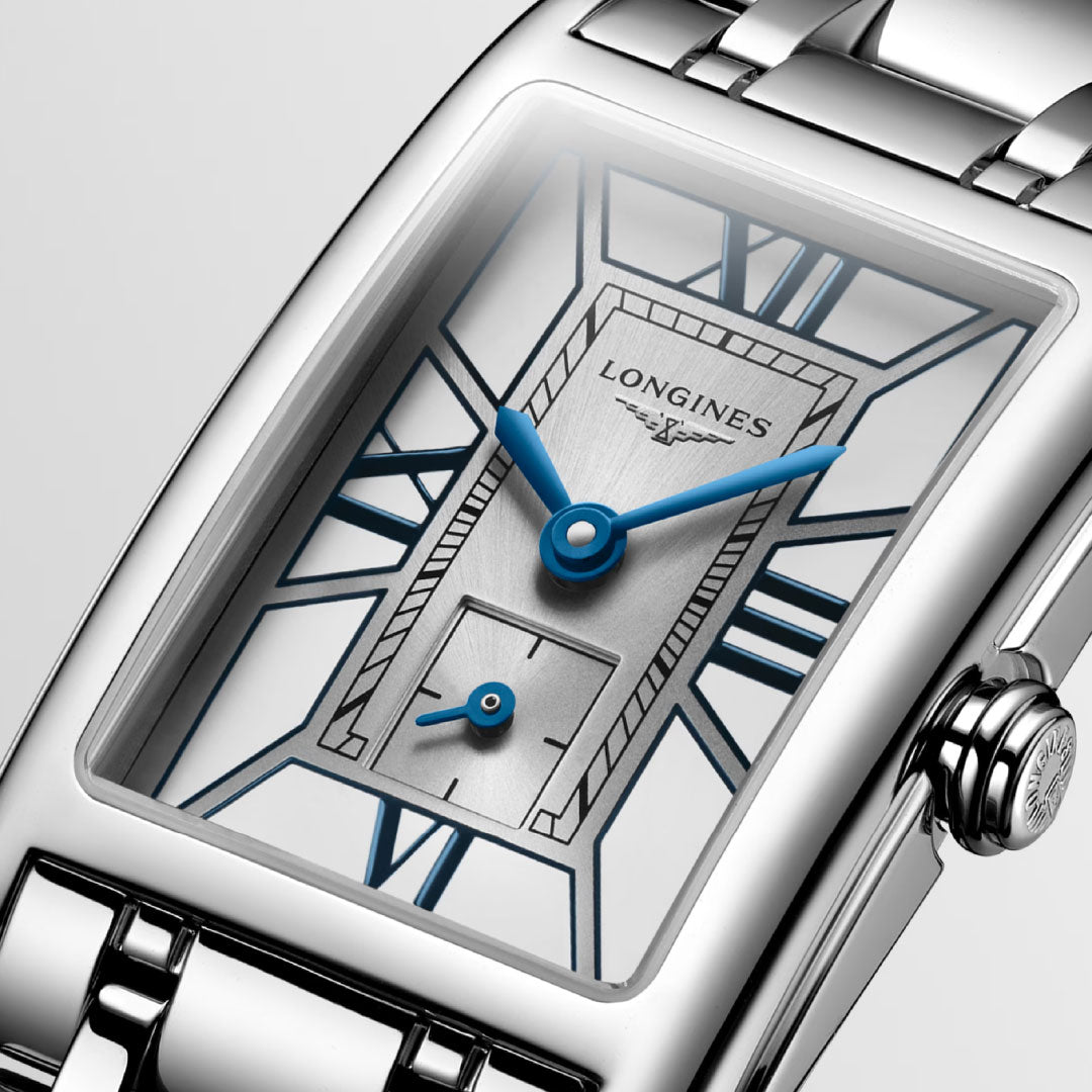 Close-up of the Longines Dolcevita Quartz 20.8 x 32mm watch featuring a rectangular silver case and bracelet, blue hands, Roman numeral markers, and a small seconds subdial for a timeless, elegant look.