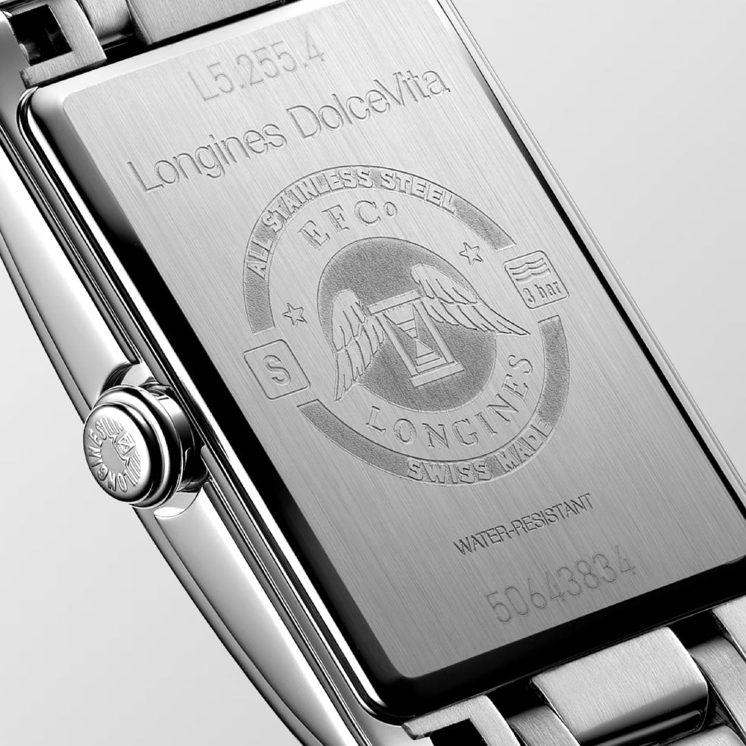 Close-up of the Longines Dolcevita Quartz 20.8 x 32mm Watch back, featuring engraved text, winged Longines logo, and serial/model numbers on brushed stainless steel—a display of refined elegance.