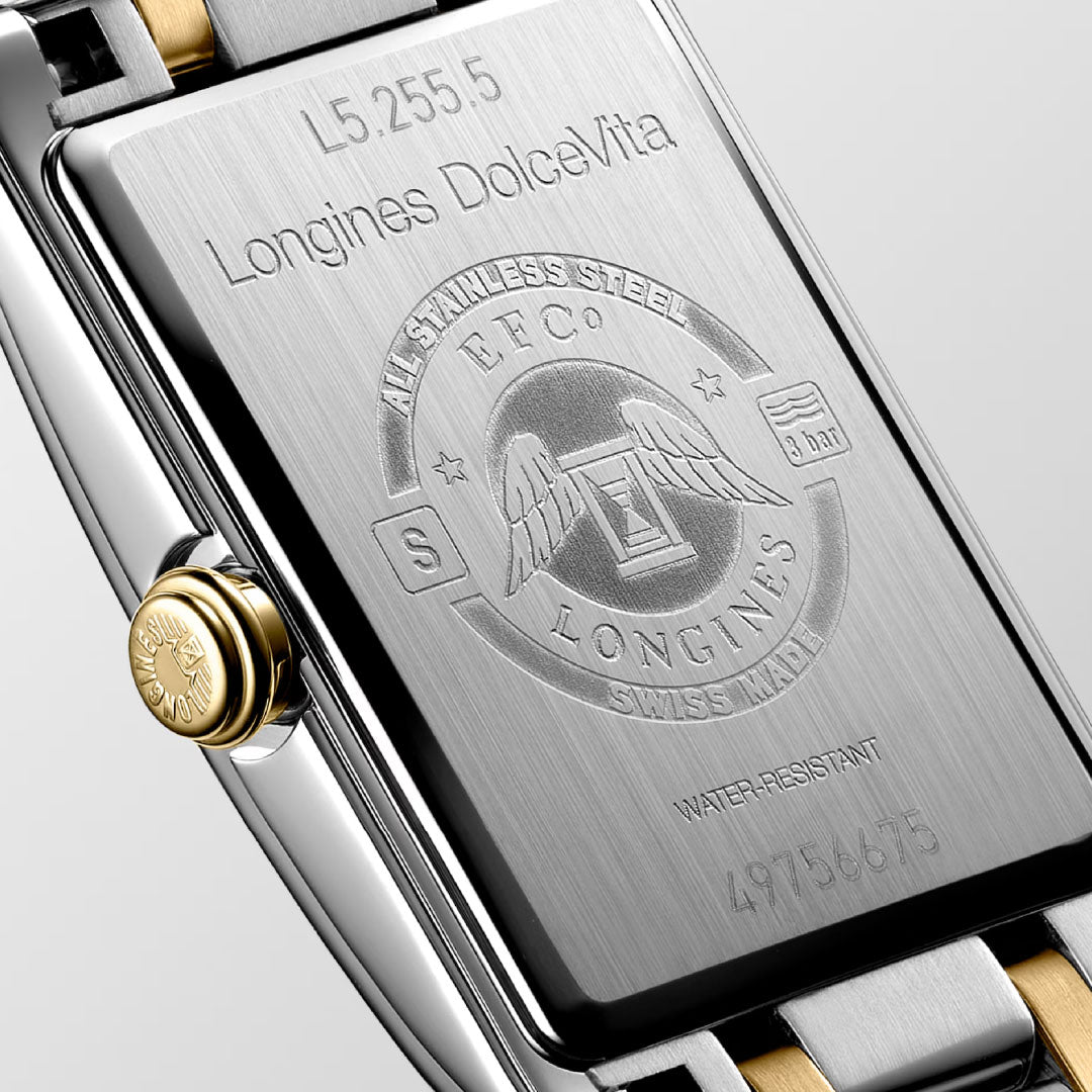 Close-up of the Longines Dolcevita Quartz 20.8 x 32mm Watch, showcasing the engraved Longines logo, serial number, and water resistance on its stainless steel and gold-tone case—a symbol of timeless elegance.