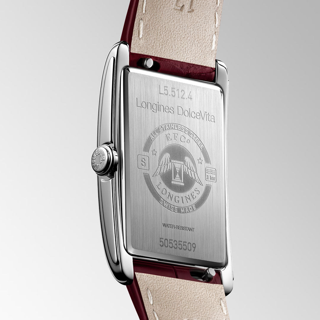 Close-up of the back of a Longines Dolcevita Quartz 23.3 x 37mm Watch, highlighting engraved details, branding, and serial number on its rectangular stainless steel case with a stitched leather strap—a striking representation of timeless elegance from Longines.