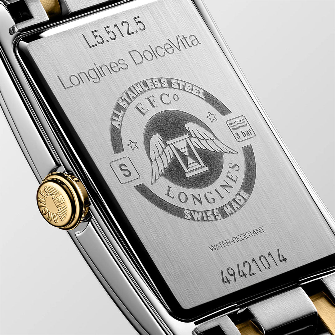 Close-up of the stainless steel back of the Longines Dolcevita Quartz 23.3 x 37mm watch, featuring engraved text, winged hourglass logo, gold crown, serial number 49421014; this Swiss-made luxury timepiece is water-resistant.