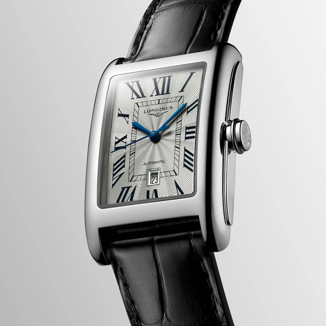 The Longines Dolcevita Automatic 27.7 x 43.8mm Watch features a rectangular silver case, Roman numerals, blue hands, a date display at 6 o'clock, and a black leather strap—showcasing classic elegance by Longines.