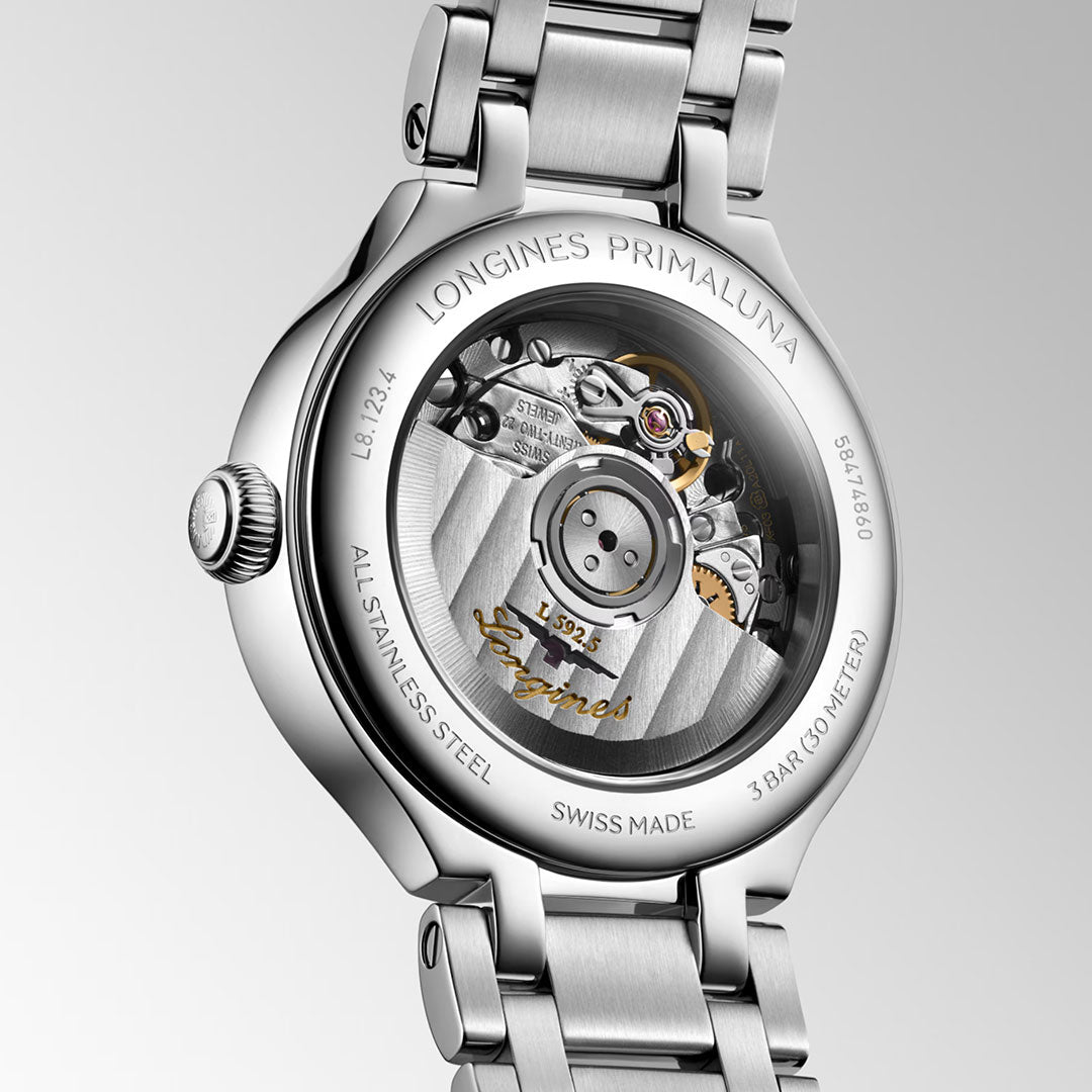 Back view of the Longines PrimaLuna Automatic 30mm Watch by Longines, showcasing its stainless steel case, transparent case back revealing the automatic movement, and engraved brand and model details.