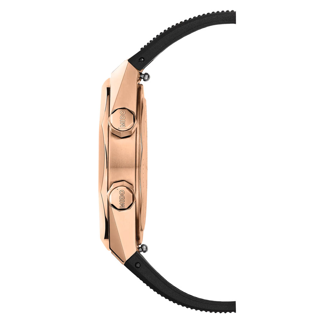 Side view of the MIDO Multifort 8 Two Crowns Automatic 40mm Watch in rose gold, showcasing two labeled crowns and a black textured strap, powered by Calibre 72 with Nivachron technology, displayed against a white background.