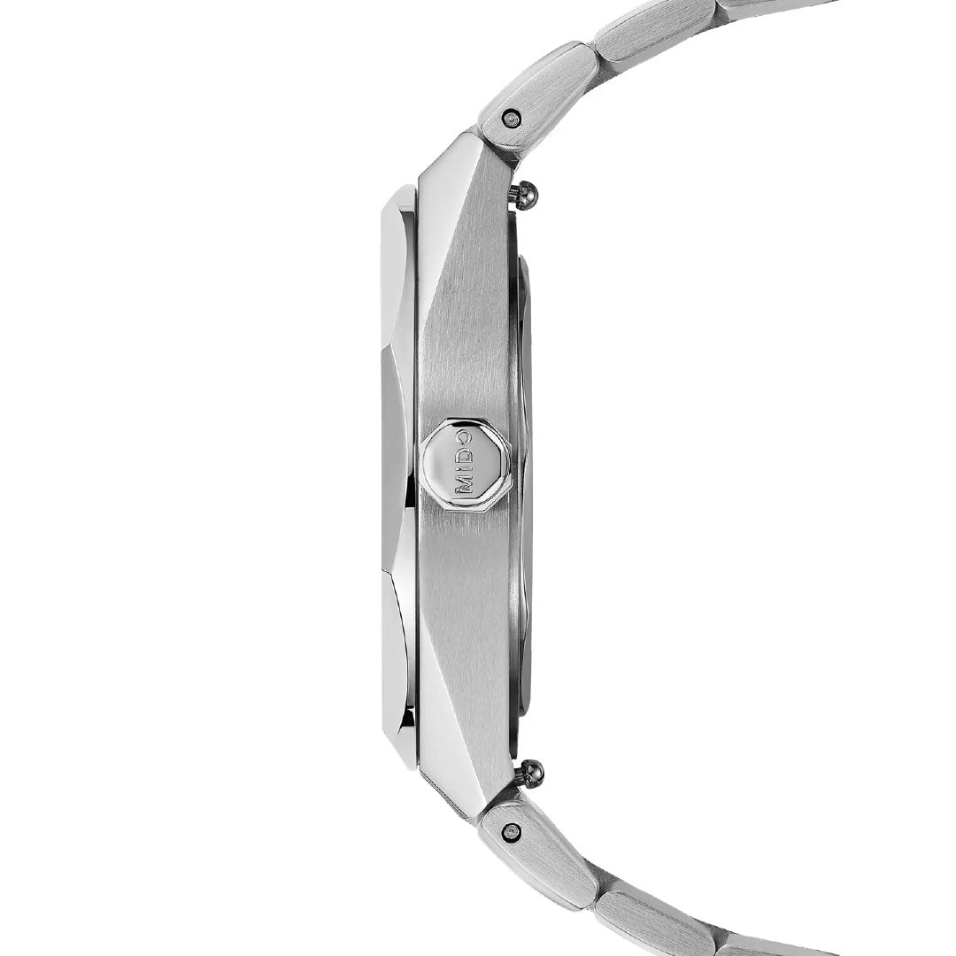 Side view of the MIDO Multifort 8 One Crown Automatic 40mm Watch in silver, featuring a metallic link band, slim case, brushed metal finish, “A&S” engraved crown, and sapphire crystal for elegant durability.