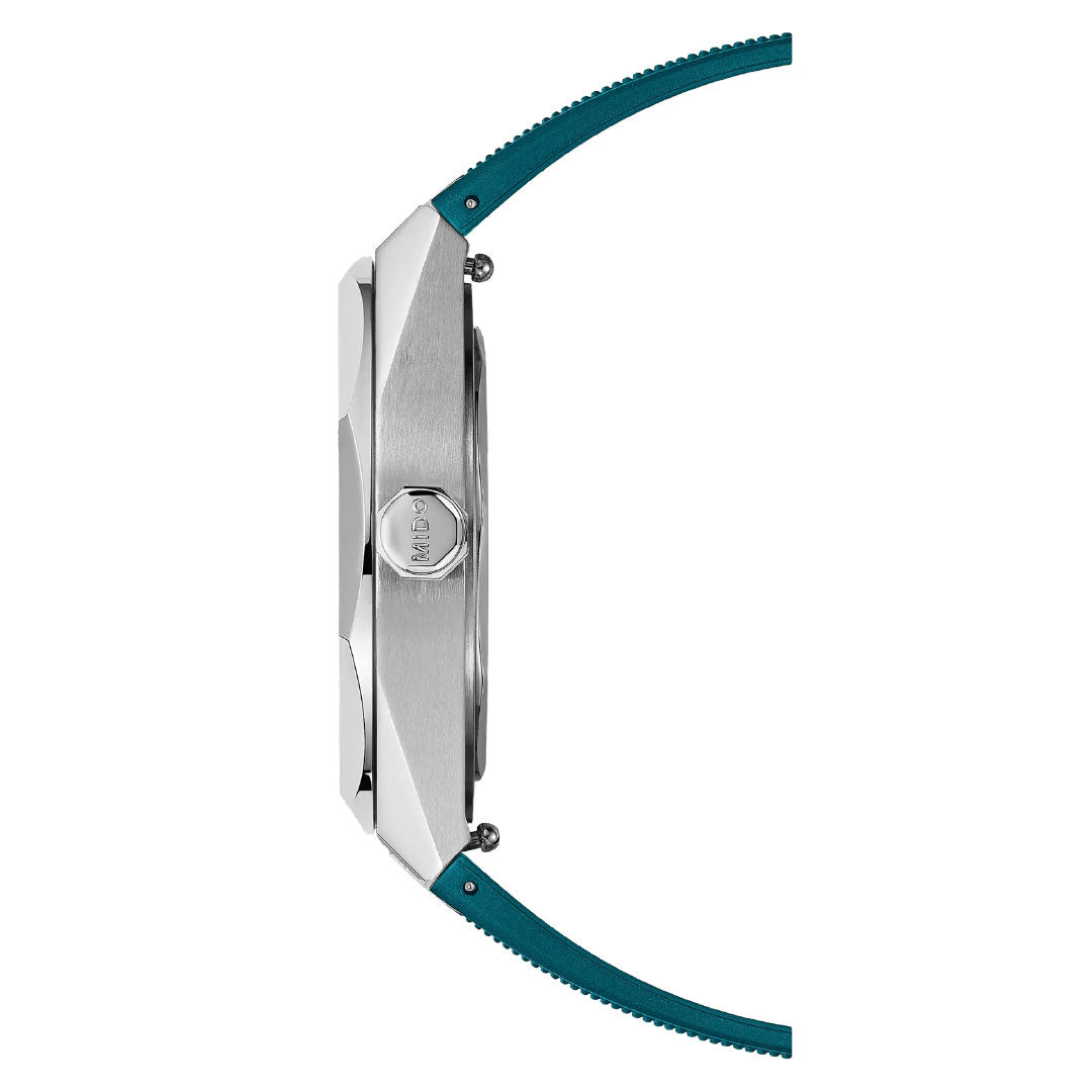 Side view of the MIDO Multifort 8 One Crown Automatic 40mm Watch shows its brushed silver case, octagonal bezel, prominent crown, and teal strap in a modern design against a white background.