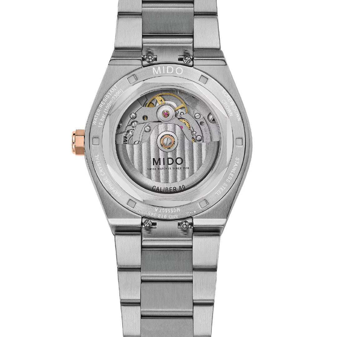 Back view of the MIDO Multifort 8 One Crown Automatic 40mm Watch, highlighting its octagonal bezel, visible Swiss automatic movement through a transparent case back, and silver bracelet.