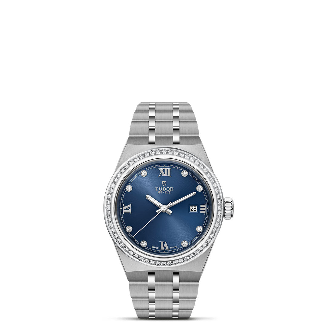 A silver TUDOR Royal wristwatch by TUDOR, featuring a blue diamond-set dial with Roman numerals, date at 3 o’clock, and a diamond-studded bezel—an automatic sport-chic watch on a white background.