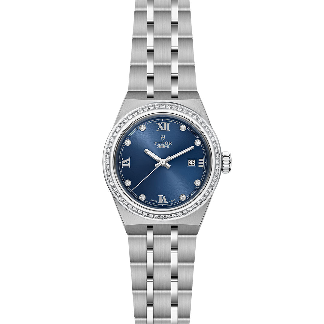 The TUDOR Royal by TUDOR is a silver wristwatch featuring a blue diamond-set dial with Roman numerals, date window, diamond hour markers, and a diamond-encrusted bezel on a stainless steel bracelet—an icon of automatic sport-chic style.