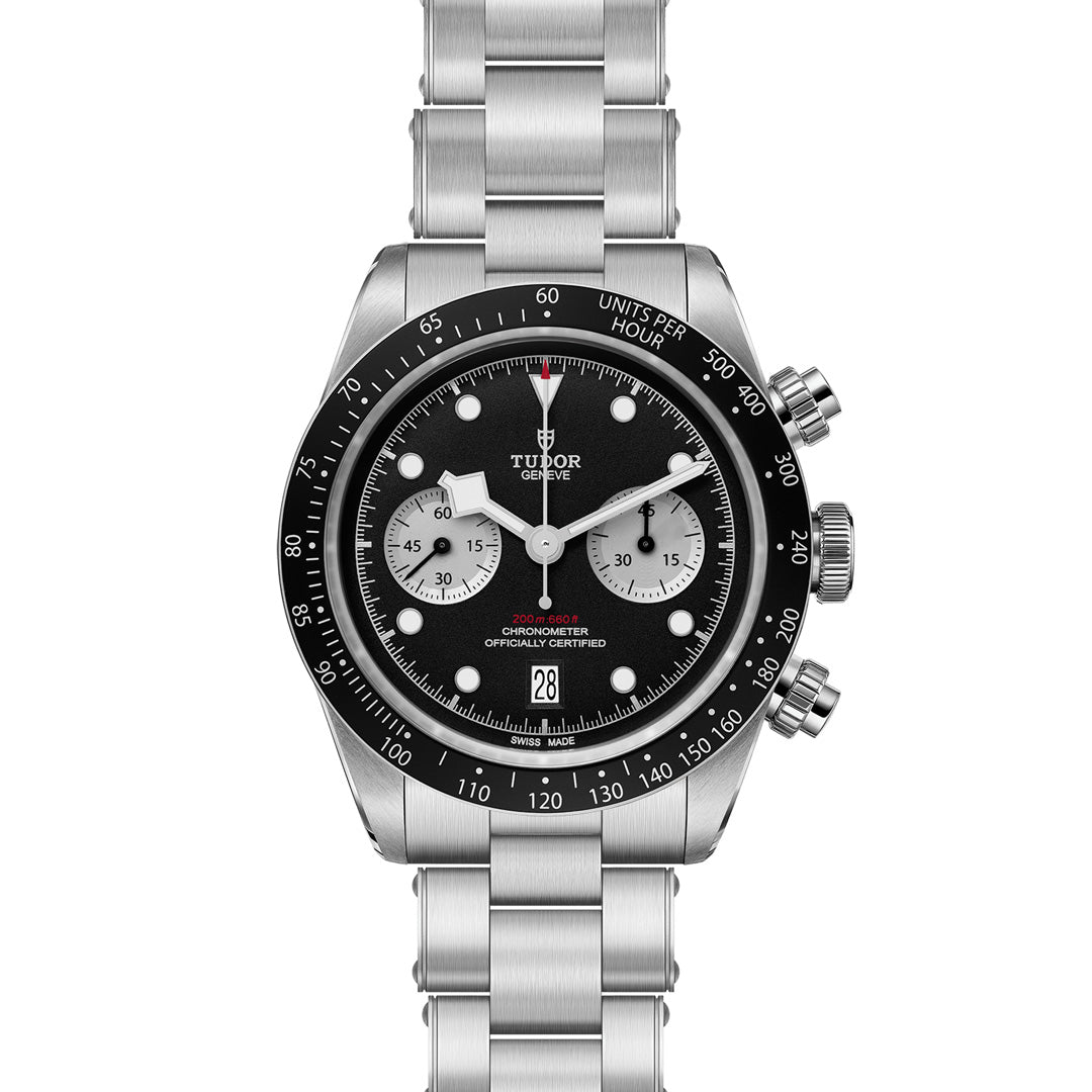 Introducing the TUDOR Black Bay Chrono, a stainless steel watch with a black dial and three sub-dials. This sports chronograph features a tachymetric bezel, date display at 6 o'clock, and is fastened with a robust T-Fit clasp on its stainless steel bracelet.