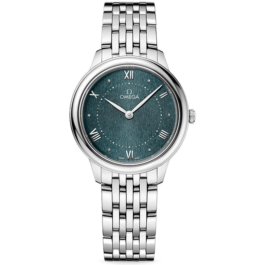 The OMEGA De Ville Prestige Quartz 30mm Watch is a stainless steel timepiece featuring a metallic linked band and a teal textured dial. It showcases Roman numerals at the 12, 3, 6, and 9 positions, with small circular markers at the other hours. The OMEGA logo is prominently displayed below the 12.